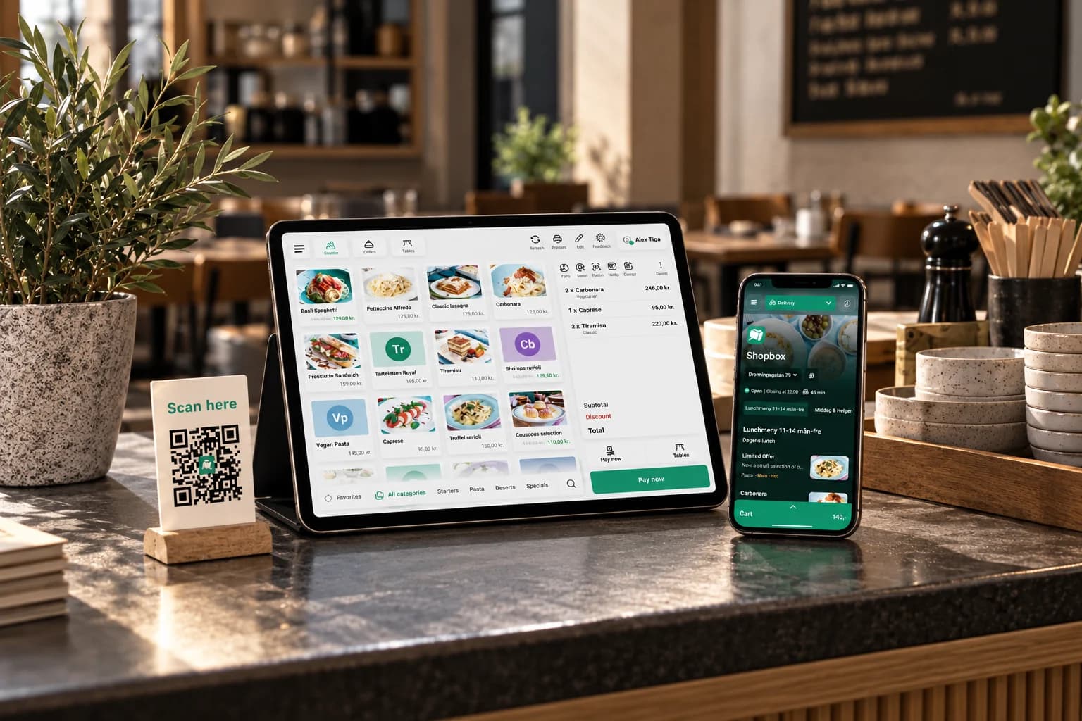 Shopbox's point of sale on a tablet and a phone on a counter