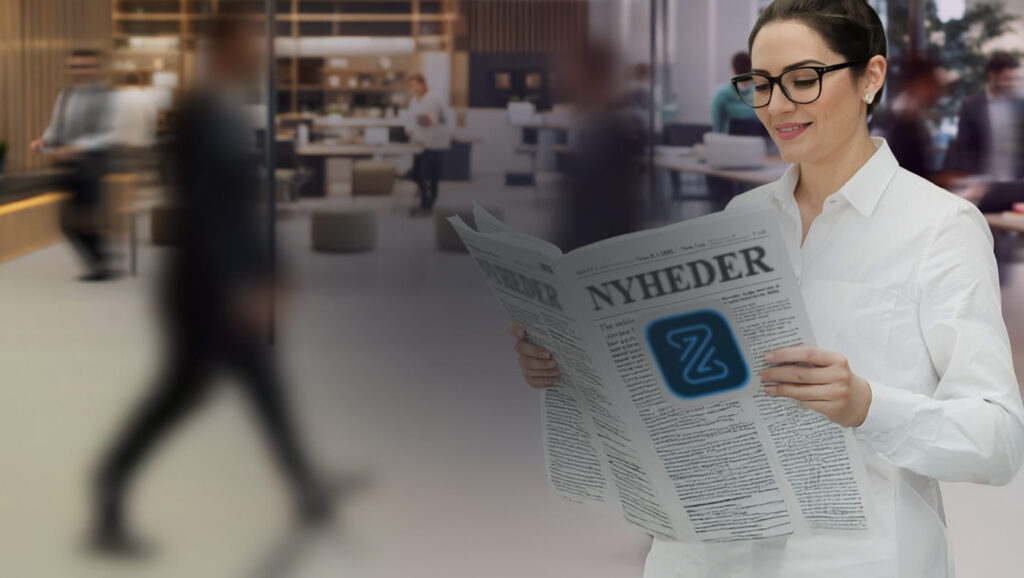 Kvinde med avis med et Zenegy Numbers logo.